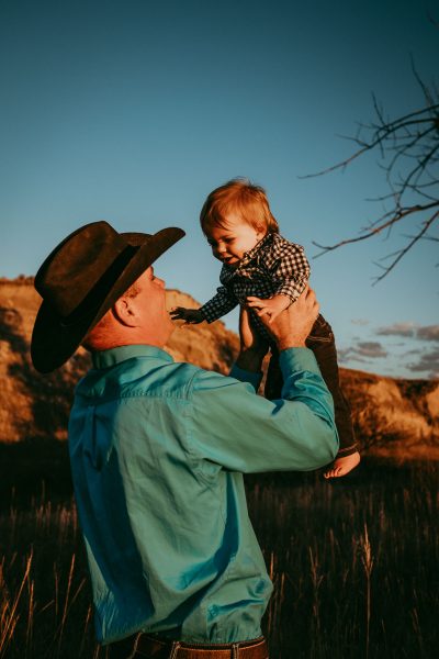 cowboy dad with baby son