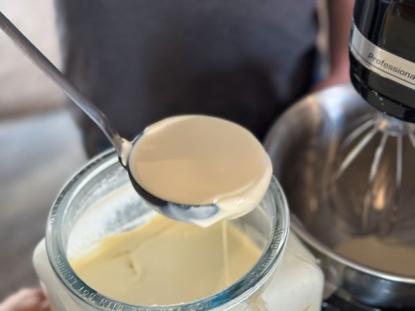 dipping cream to make butter while modern homesteading